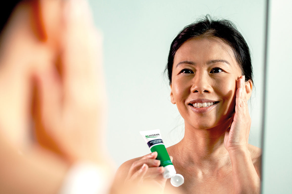 ALHYDRAN scar treatment cream being used on face