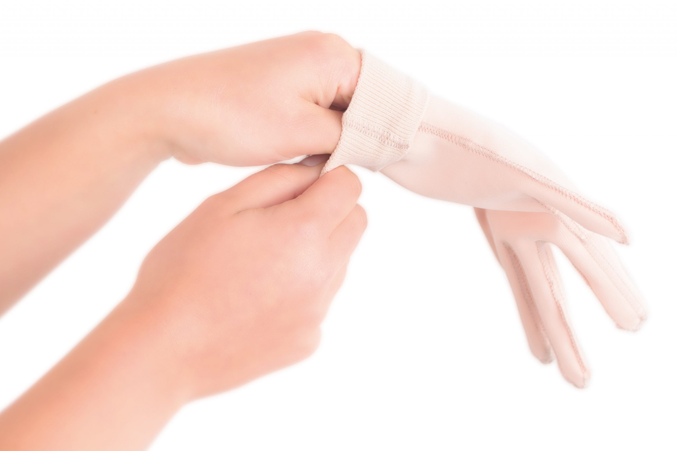 Applying Scarban silicone glove to hand and fingers for scar care after burns or surgery