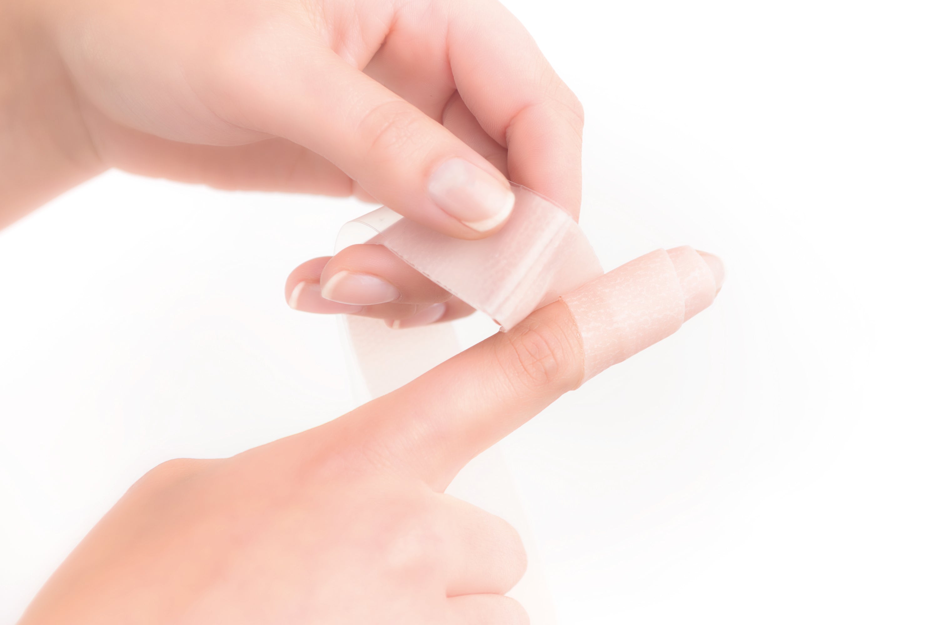 Scarban silicone tape applied to finger for scar reduction and keloid prevention after injury or surgery