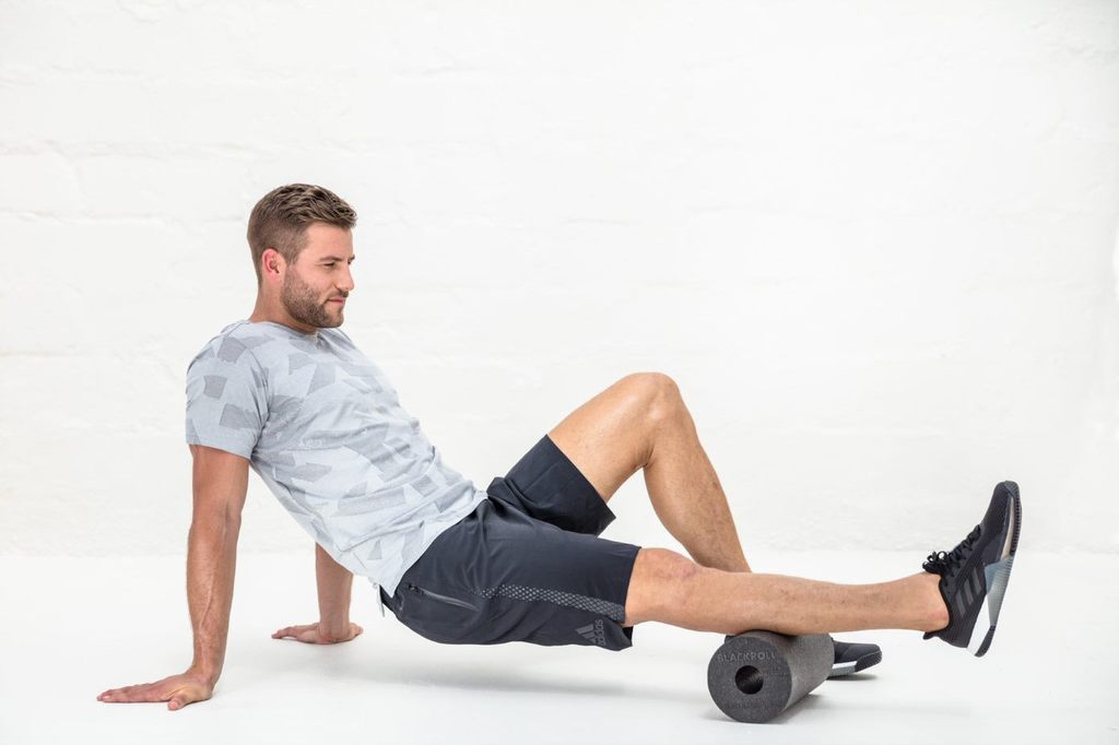 Man showing how to use a foam roller nz