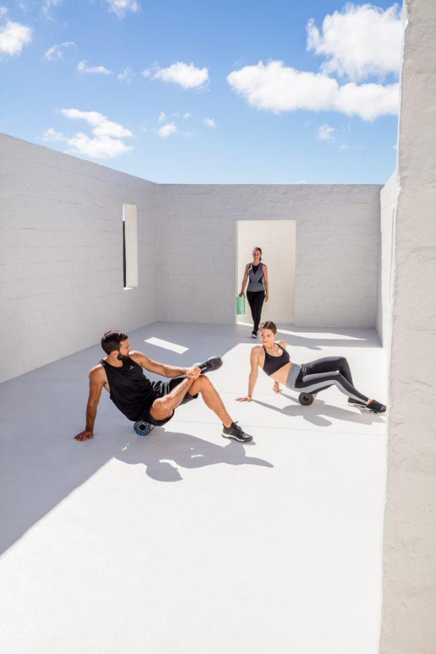 Three people showing different foam roller exercises