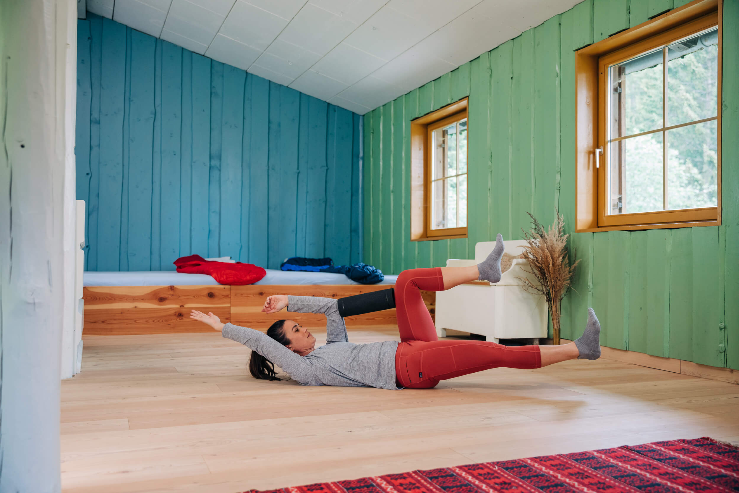 Woman showing foam roll exercises